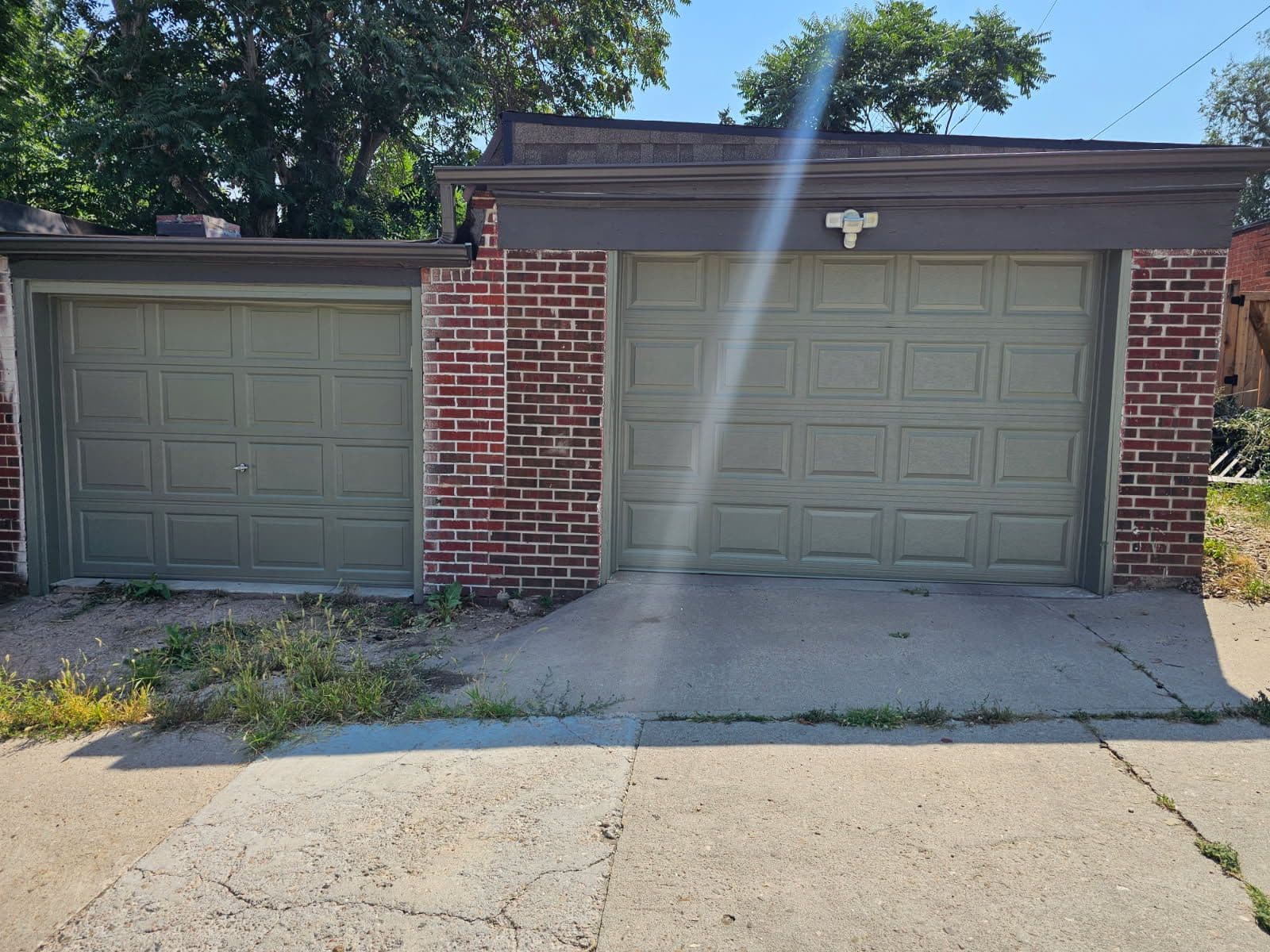 Project Vibrant Garage Doors Against Classic Brick image